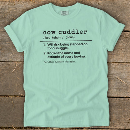 Light blue Comfort Colors t-shirt with "cow cuddler" definition.