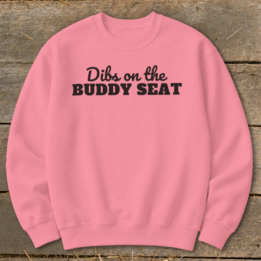 Pink sweatshirt with black text reading "Dibs on the BUDDY SEAT".