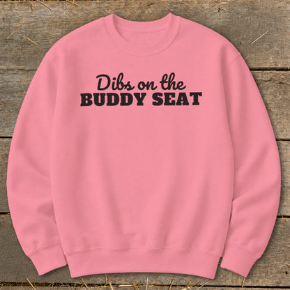 Pink sweatshirt with black text reading "Dibs on the BUDDY SEAT".