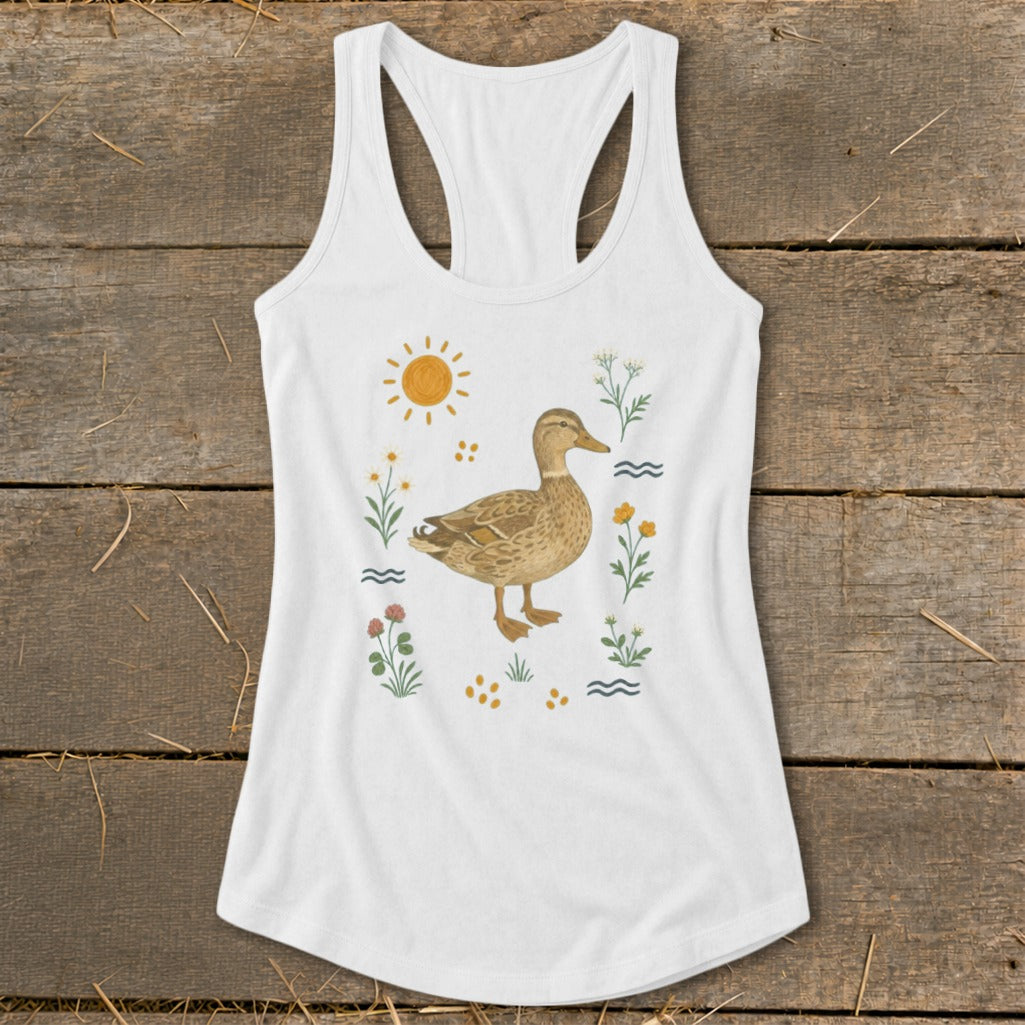 White tank top with a duck illustration surrounded by flowers, sun, and water.