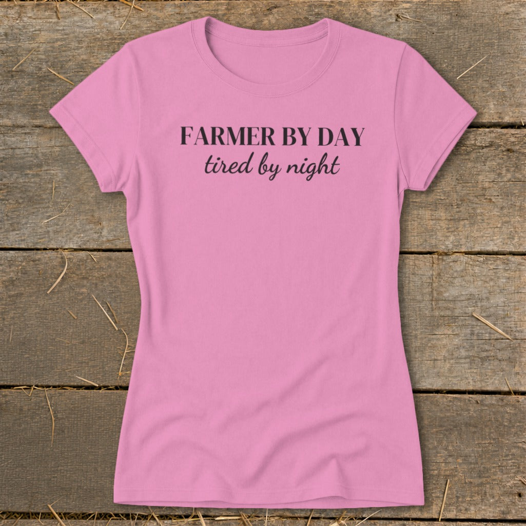 Pink t-shirt with "FARMER BY DAY tired by night" text.