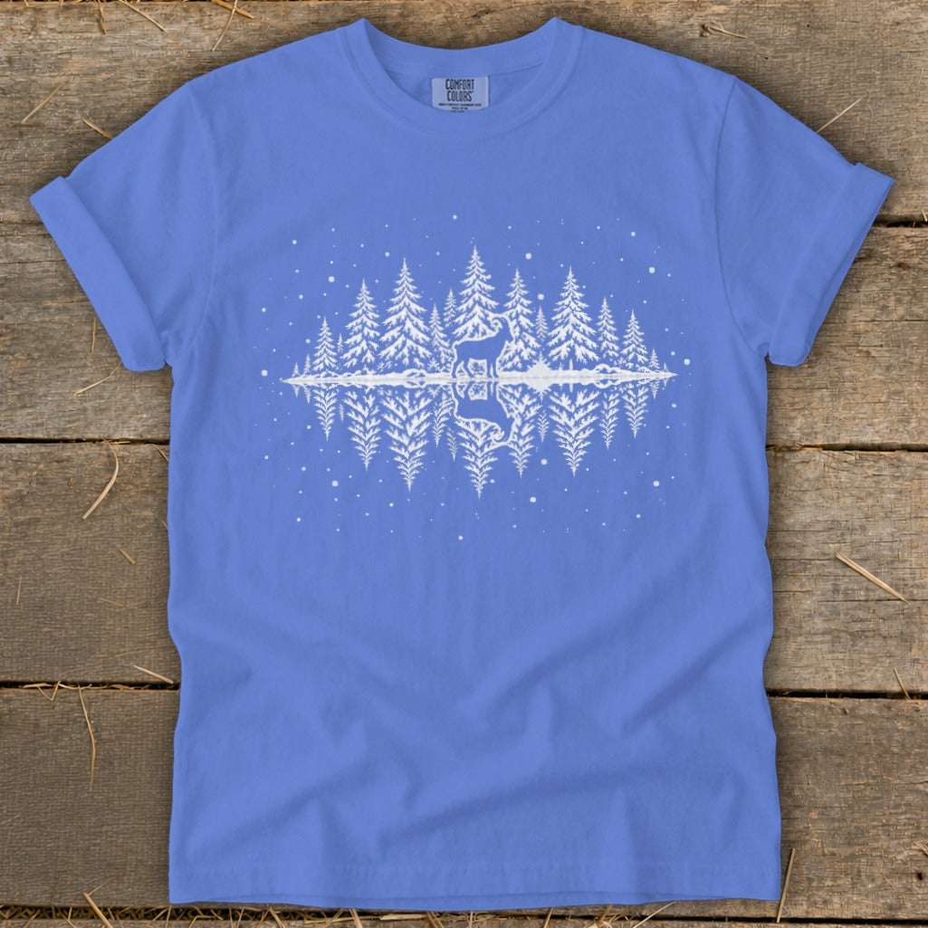 Blue t-shirt with white graphic of deer, trees, and reflection.