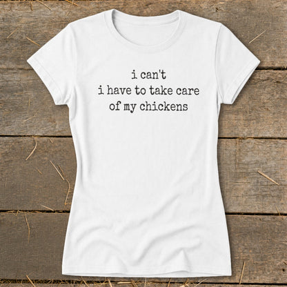 White t-shirt with black text: "i can't i have to take care of my chickens"