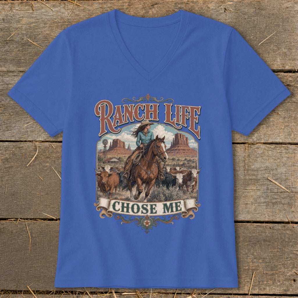 Ranch Life Chose Me graphic on blue v-neck t-shirt with cowgirl and cattle scene.