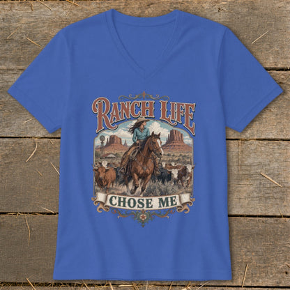 Ranch Life Chose Me graphic on blue v-neck t-shirt with cowgirl and cattle scene.