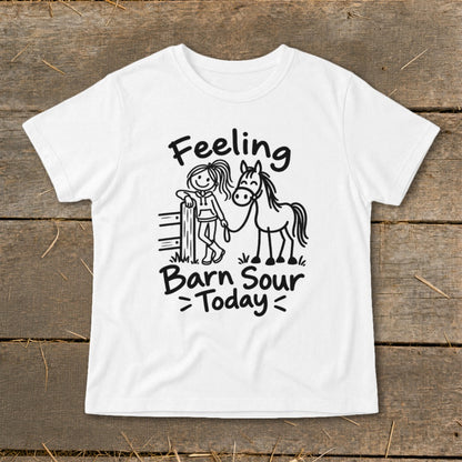 White t-shirt with "Feeling Barn Sour Today" text and stick figure girl with horse.