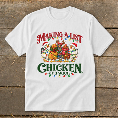 White t-shirt with five chickens wearing Santa hats and Christmas lights, text "MAKING A LIST CHICKEN IT TWICE."
