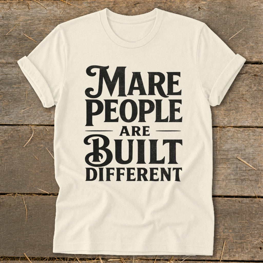 Cream t-shirt with black text that reads "Mare People Are Built Different."