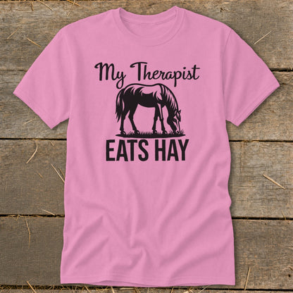 Pink t-shirt with "My Therapist EATS HAY" text and a horse graphic.