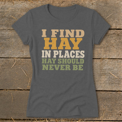 Women's grey t-shirt with "I FIND HAY IN PLACES HAY SHOULD NEVER BE" text.
