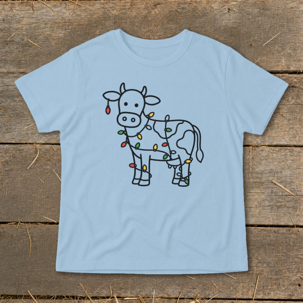 Line art cow with festive Christmas lights and spots on light blue t-shirt.