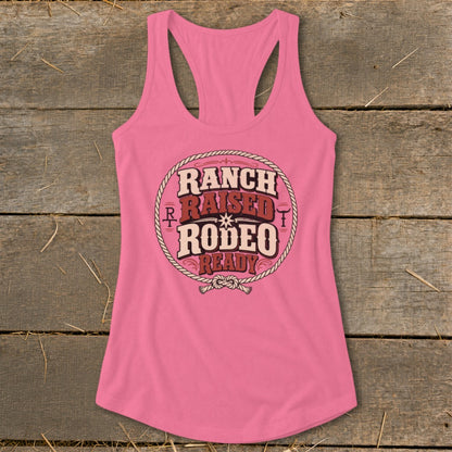 Pink tank top with "Ranch Raised Rodeo Ready" text inside a rope circle.