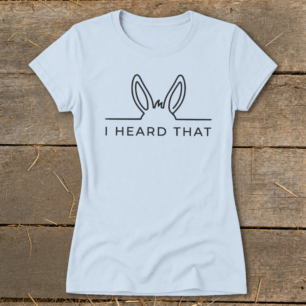 Light blue t-shirt with black outline of donkey ears and text "I HEARD THAT".
