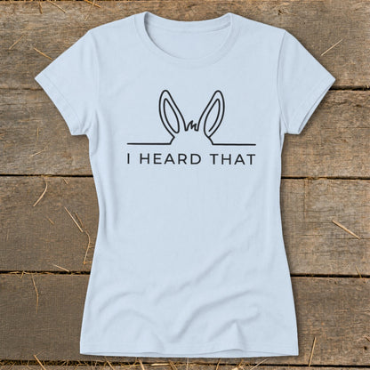 Light blue t-shirt with black outline of donkey ears and text "I HEARD THAT".