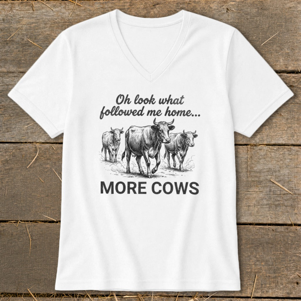 White v-neck t-shirt with three cows and text "Oh look what followed me home... MORE COWS".