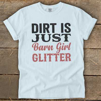 White t-shirt with black and pink text that reads "DIRT IS JUST Barn Girl GLITTER".