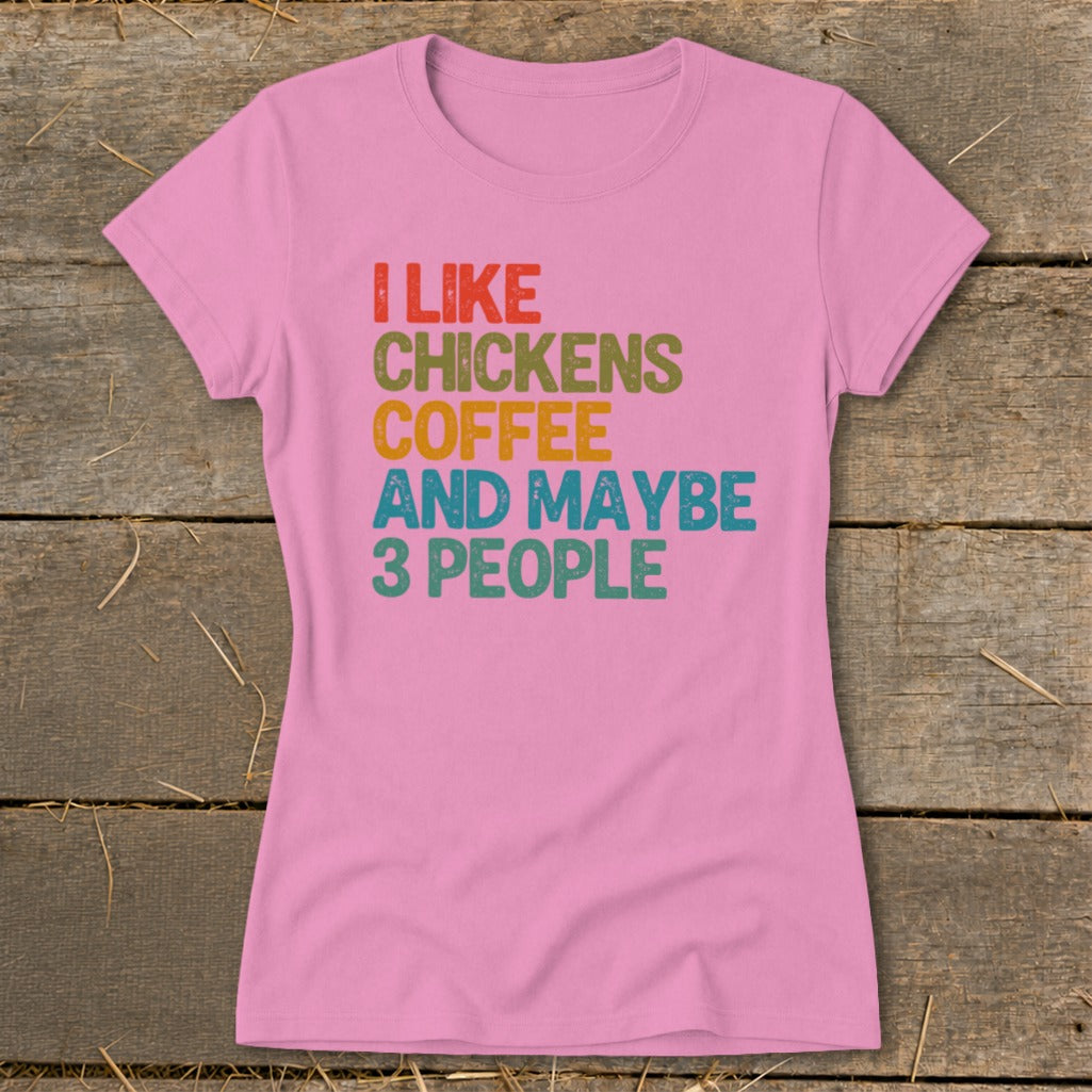 Pink t-shirt with "I like chickens coffee and maybe 3 people" text.