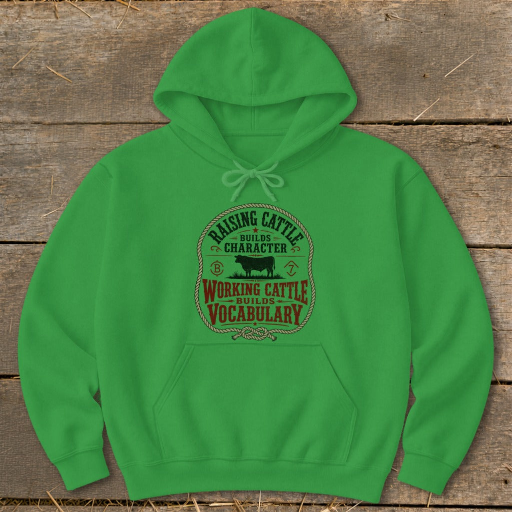 Green hoodie with "Raising cattle builds character. Working cattle builds vocabulary." text design.