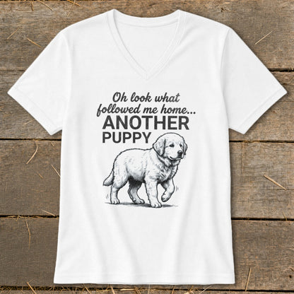 White v-neck t-shirt with text "Oh look what followed me home... ANOTHER PUPPY" and a golden retriever puppy graphic.