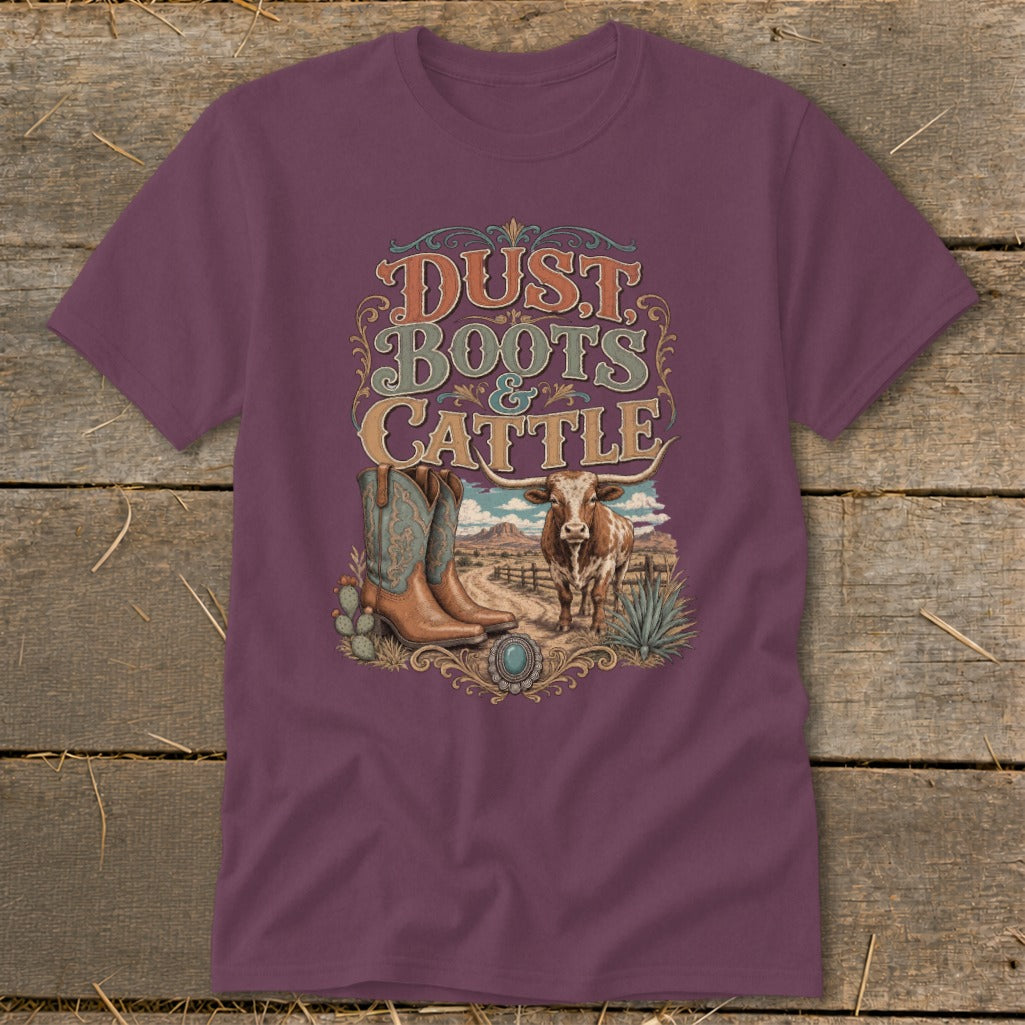 Maroon t-shirt with "Dust Boots & Cattle" text, cowboy boots, and longhorn cow.