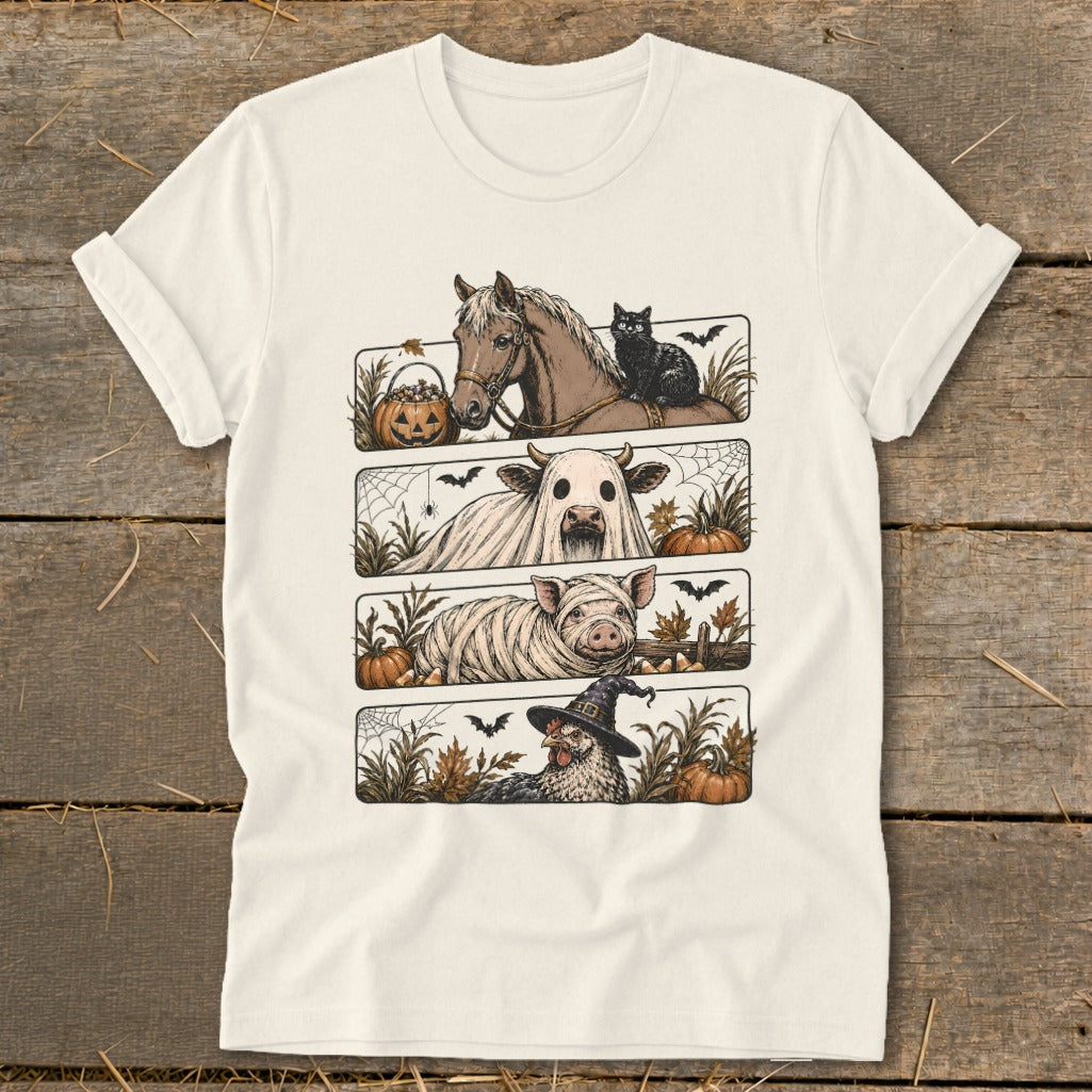 T-shirt graphic with horse, cow ghost, mummy pig, and chicken witch for Halloween.