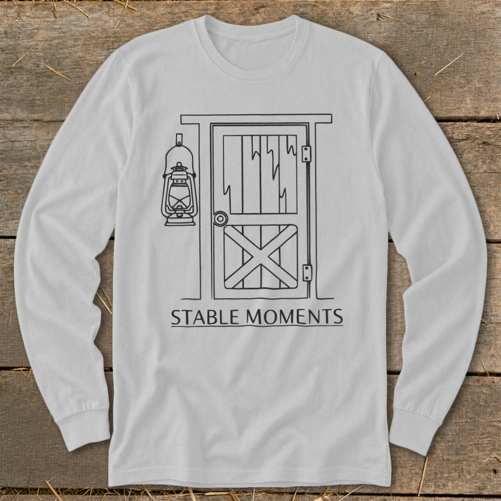Long sleeve shirt with a black line drawing of a barn door, lantern, and text.