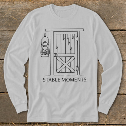 Long sleeve shirt with a black line drawing of a barn door, lantern, and text.