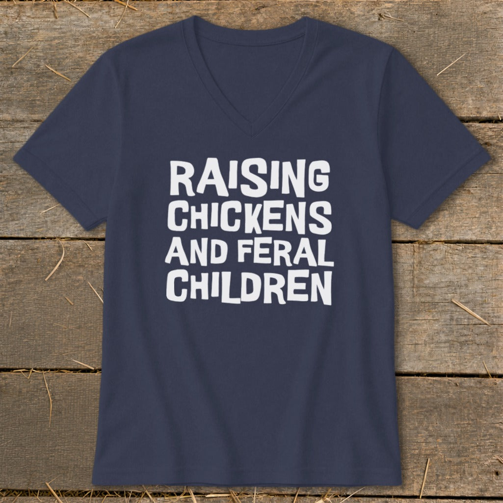 Navy v-neck t-shirt with white text: Raising Chickens And Feral Children.