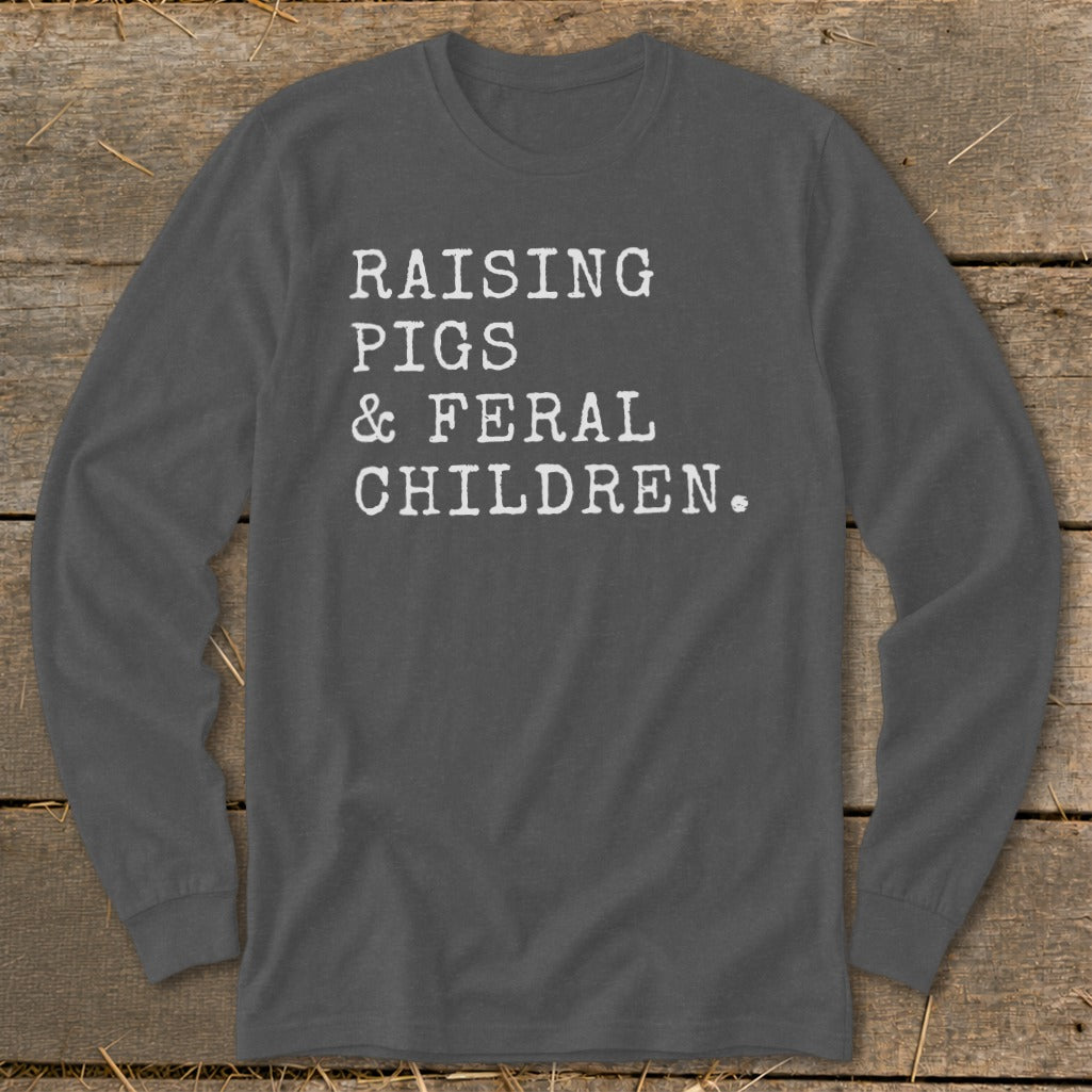 Charcoal long sleeve shirt with white text "RAISING PIGS & FERAL CHILDREN."