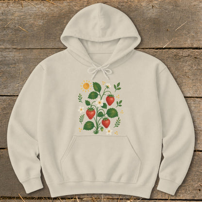 Cream hoodie with strawberry plant, sun, and flower graphic on chest.