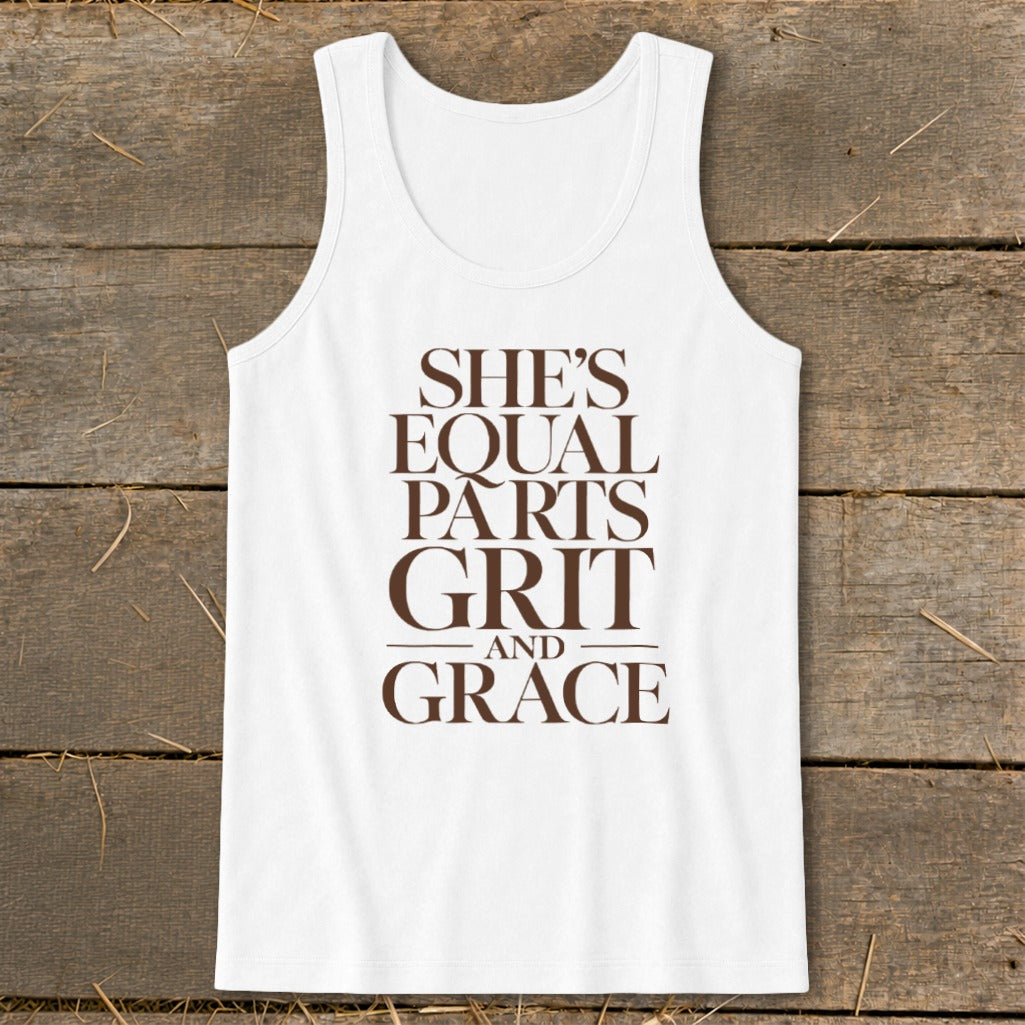 White tank top with brown text: "SHE'S EQUAL PARTS GRIT AND GRACE".