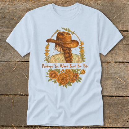 Light blue t-shirt with illustration of woman in cowboy hat, flowers, and text "Perhaps You Were Born For This".