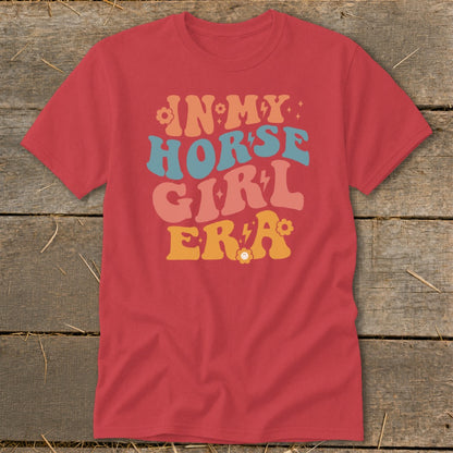 Red t-shirt with "IN MY HORSE GIRL ERA" text in retro font.