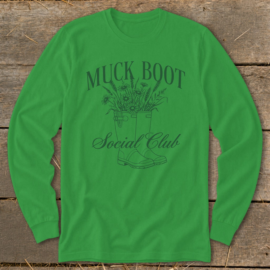 Green long-sleeve shirt with "Muck Boot Social Club" text and a drawing of boots with flowers.