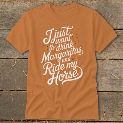 Orange t-shirt with white text saying "I just want to drink Margaritas and Ride my Horse".