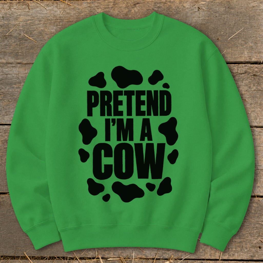Green sweatshirt with "PRETEND I'M A COW" text and black cow spots.