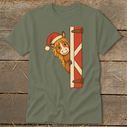 Illustration of a horse wearing a Santa hat peeking around a barn door.