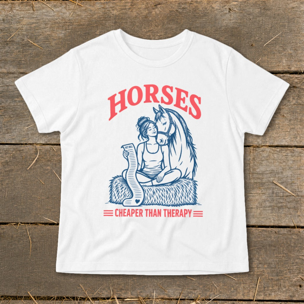 White t-shirt with "HORSES CHEAPER THAN THERAPY" text and horse and girl illustration.