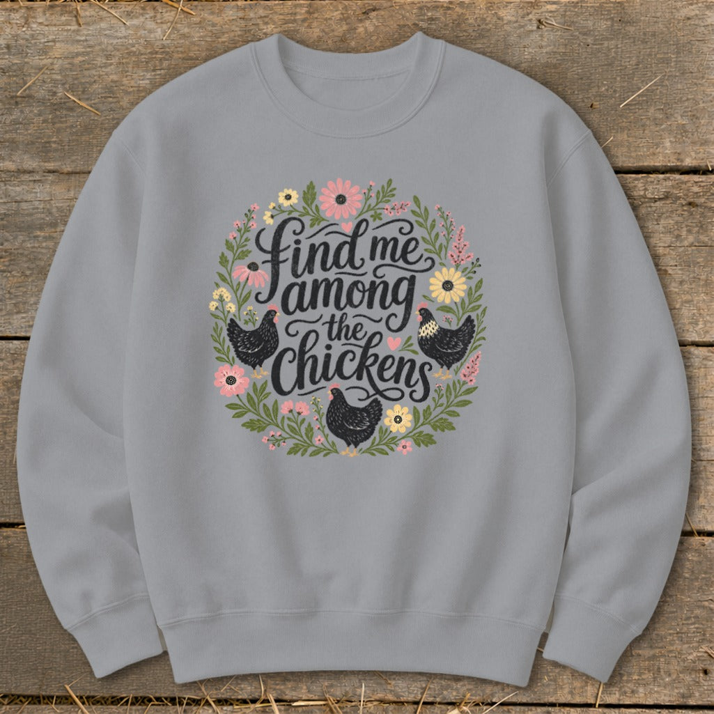 Gray sweatshirt with floral wreath and text "Find me among the chickens".