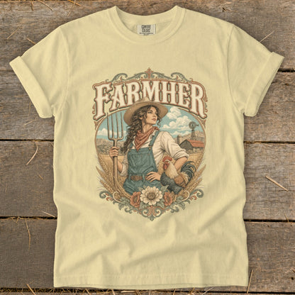 Light yellow t-shirt with "FARMHER" text, woman farmer with pitchfork, and rooster artwork.