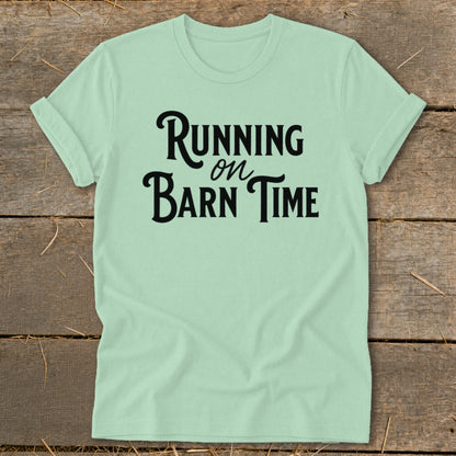 Mint t-shirt with black text reading "Running on Barn Time".