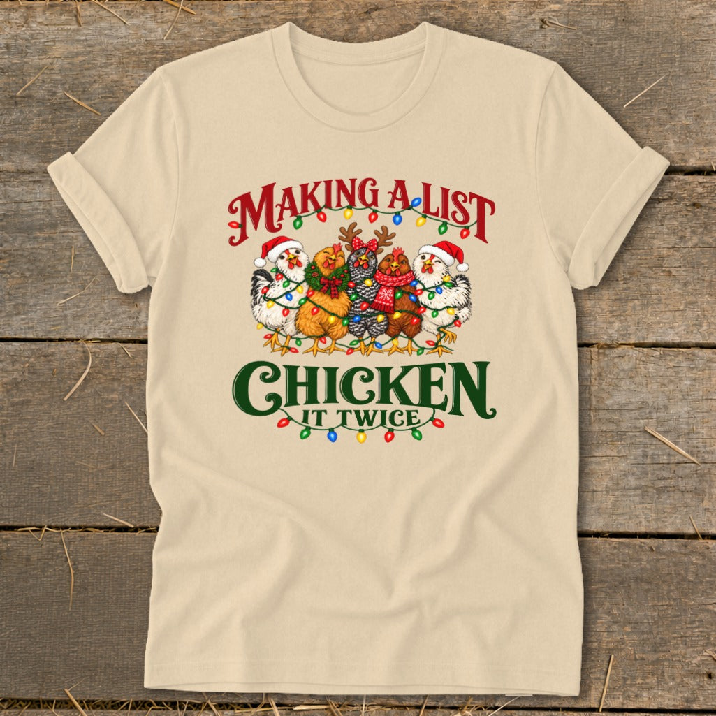 T-shirt with five chickens wearing Santa hats and Christmas lights, saying "Making a list chicken it twice".