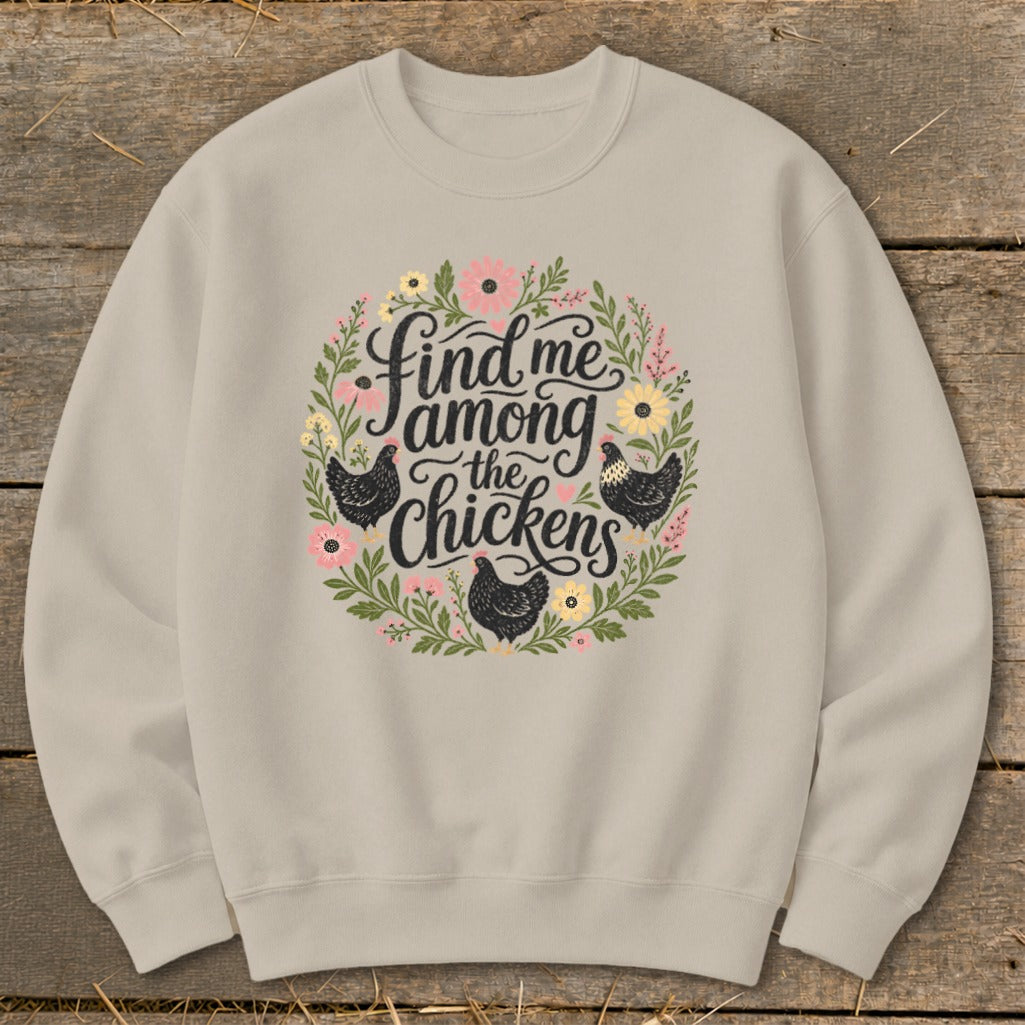 Light tan crewneck sweatshirt with "Find me among the chickens" in floral wreath design.
