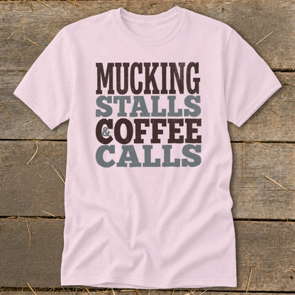 Pink t-shirt with "Mucking Stalls Coffee Calls" text design.