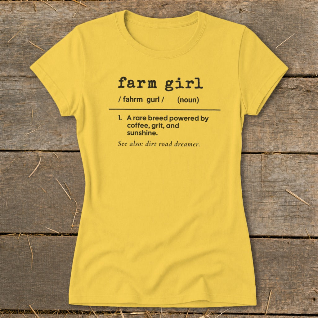Yellow t-shirt with "farm girl" definition: powered by coffee, grit, and sunshine.