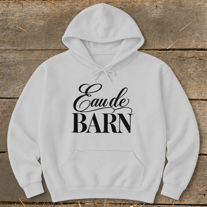White hoodie with "Eau de BARN" text in black cursive font.