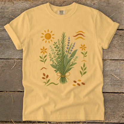Yellow t-shirt with a floral bouquet, sun, and wavy lines graphic.
