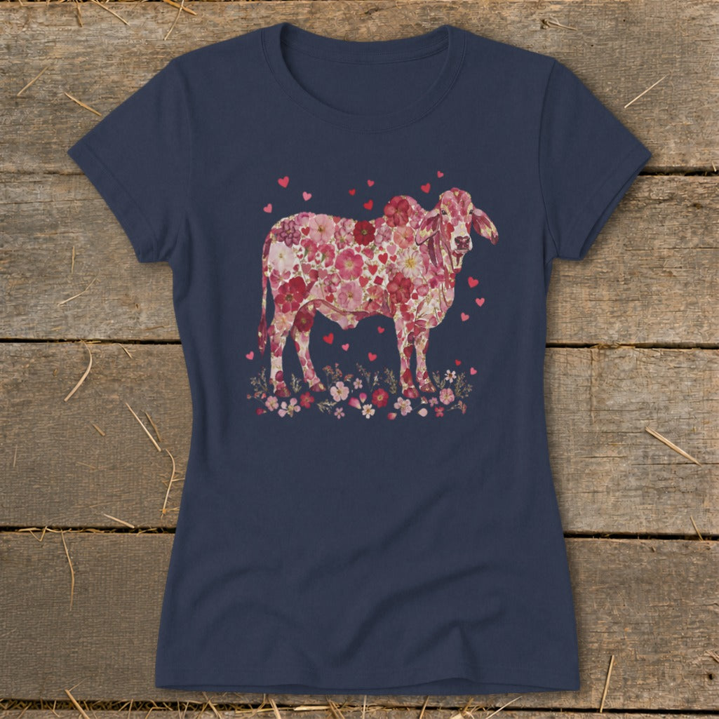 Navy t-shirt with a pink floral cow and heart graphic.