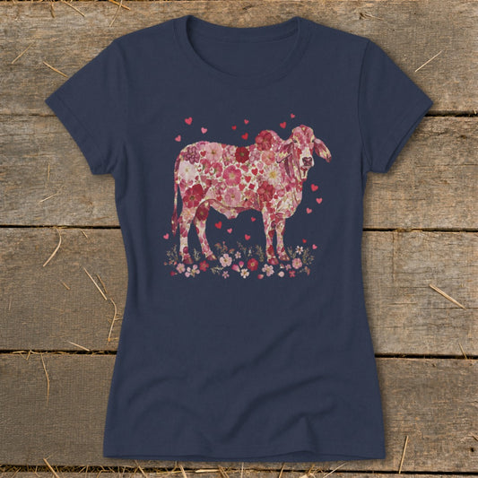 Navy t-shirt with a pink floral cow and heart graphic.