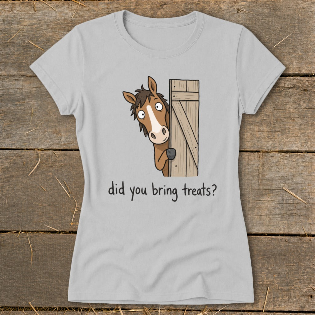 Light grey t-shirt with a cartoon horse peeking from behind a wooden gate asking "did you bring treats?".